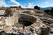 The palace of Festos. The West Court and Theatral Area, storage pits in the foreground.